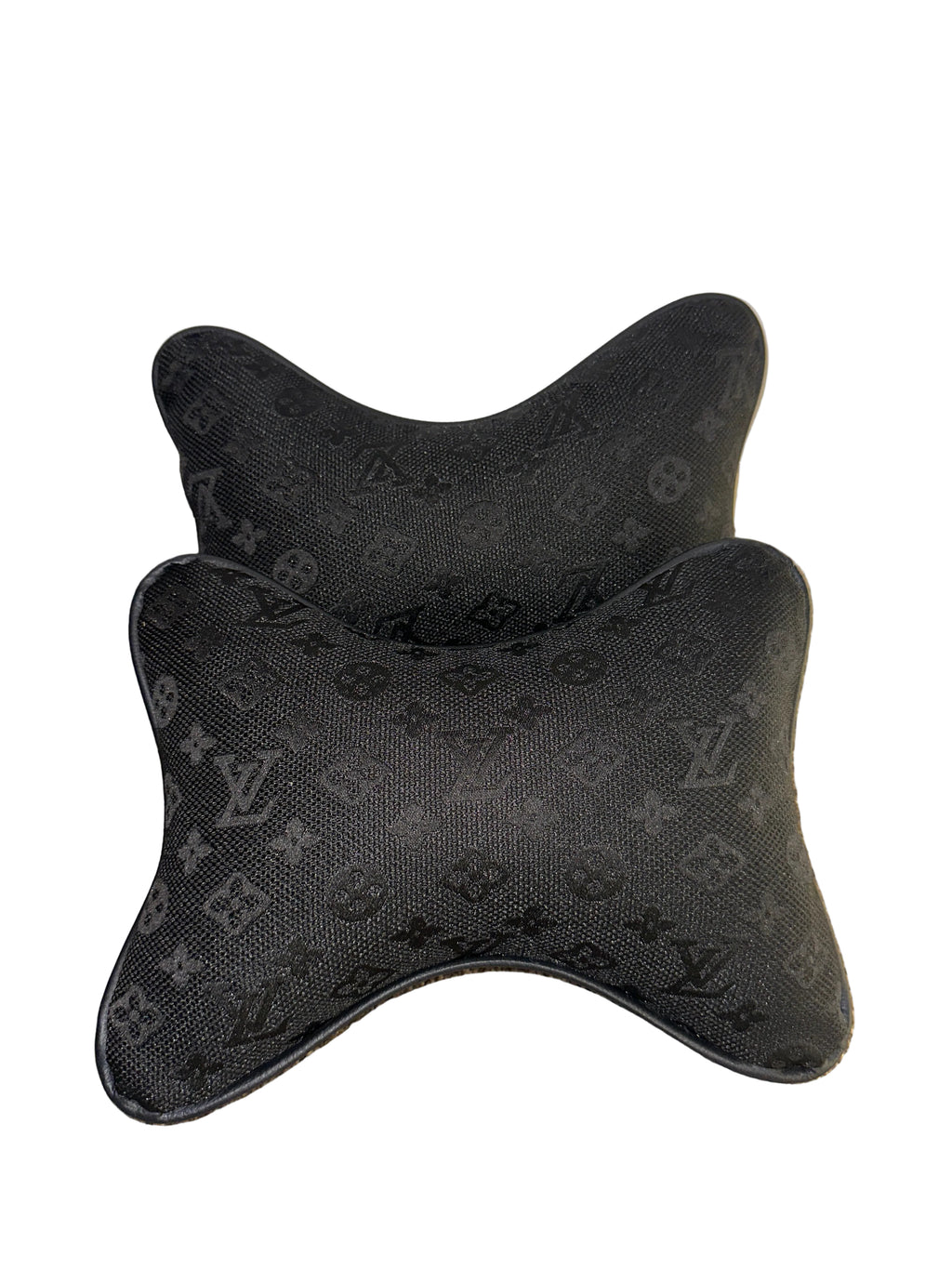 Black patterned car headrest cover on a light background