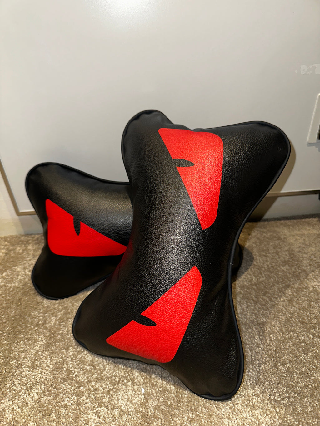 Black and red saddle pad on a metallic surface