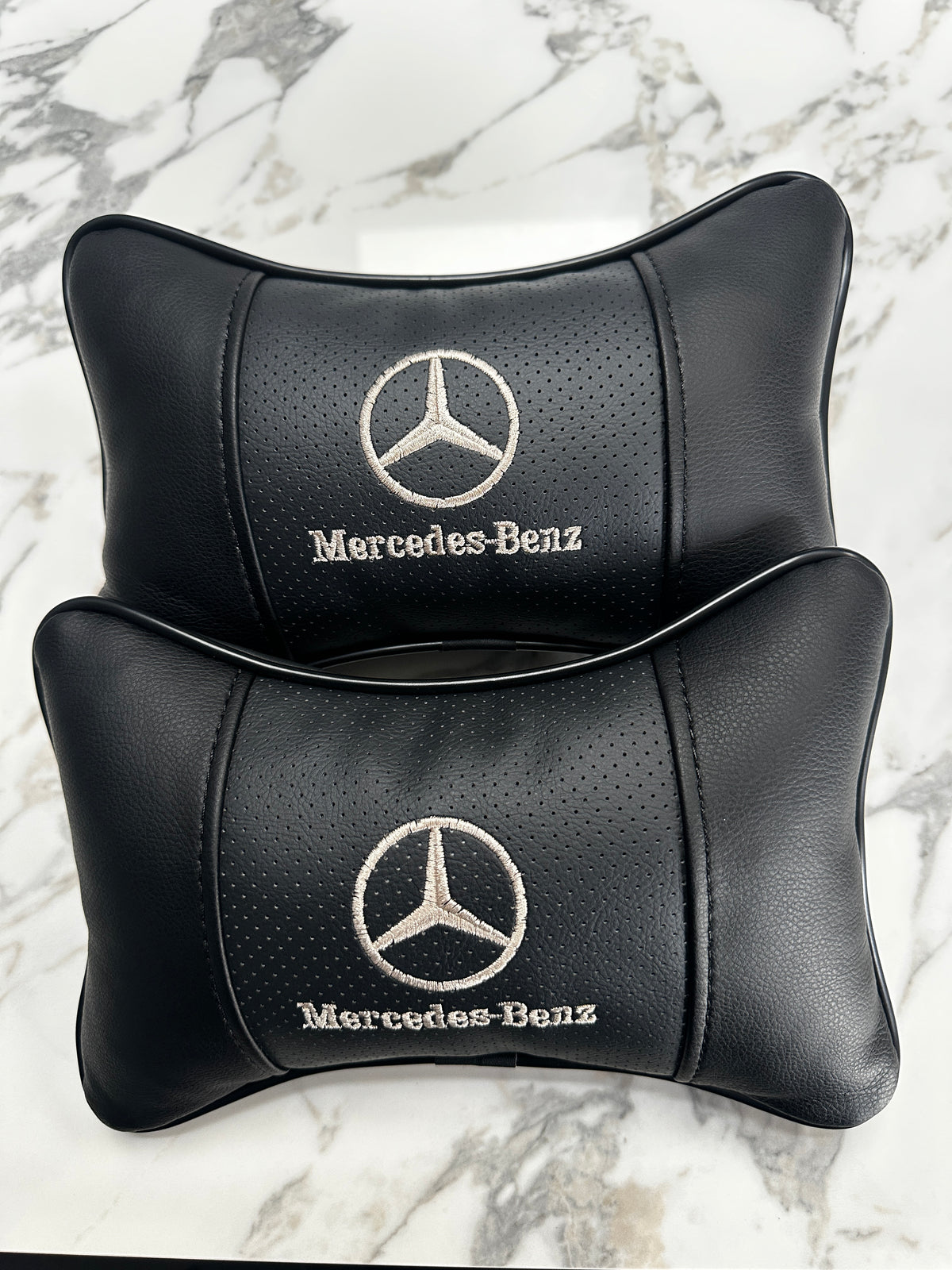 Black German car neck pillow pair for BMW Mercedes or Audi interiors